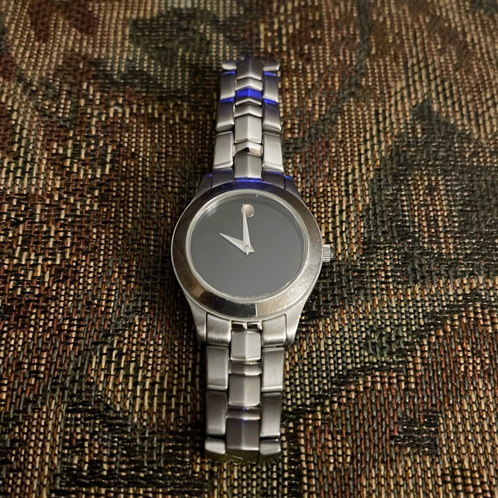 Women’s Movado watch in classic Silvertone & black face.
